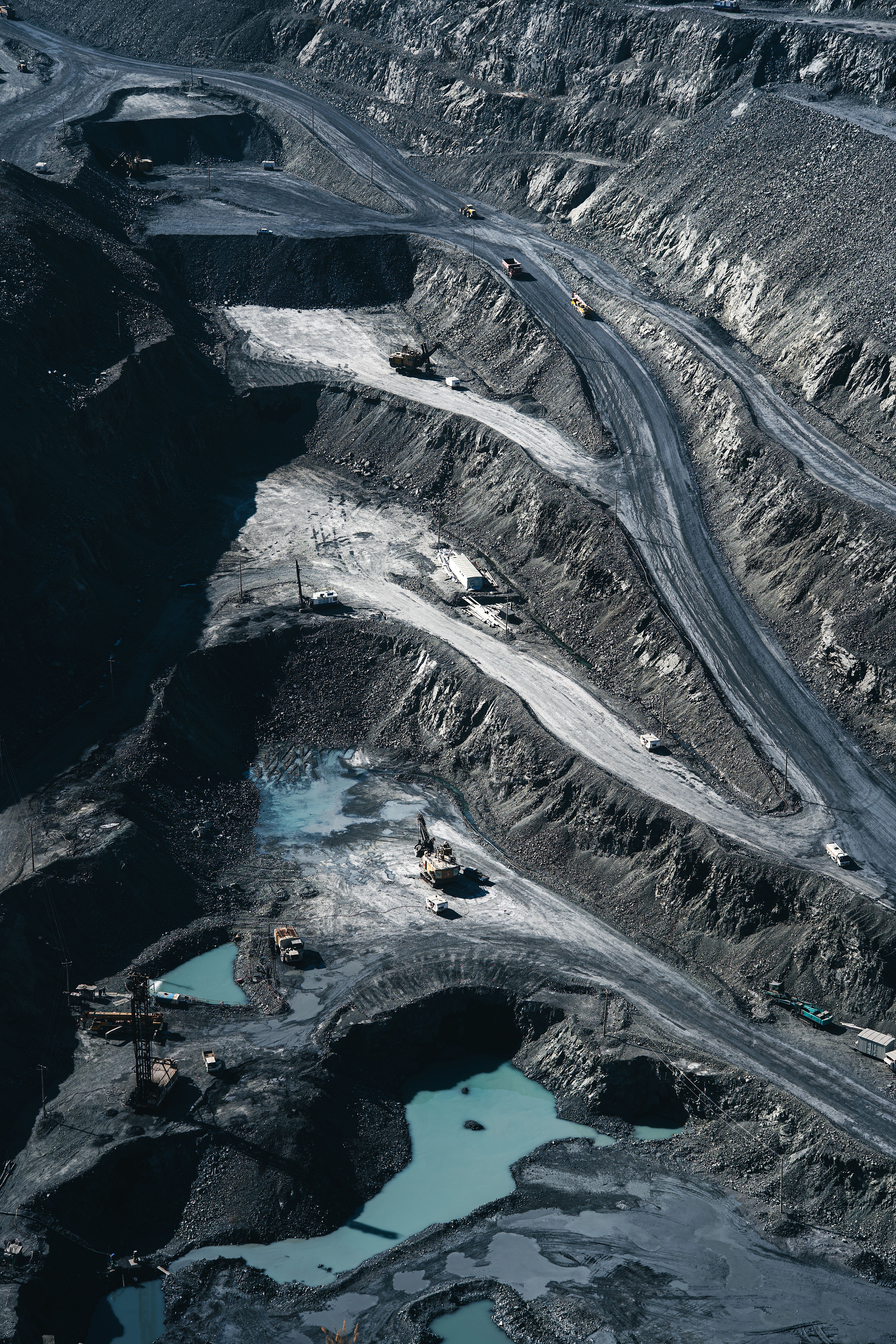 Aerial view of a mine haul road showing road edges, surrounding slopes and surface conditions