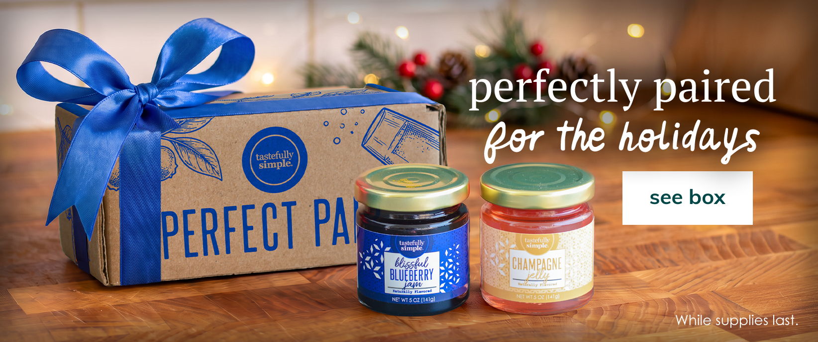 Perfectly paired for the holidays. Gift box with two jars of jam and a blue ribbon. See box.