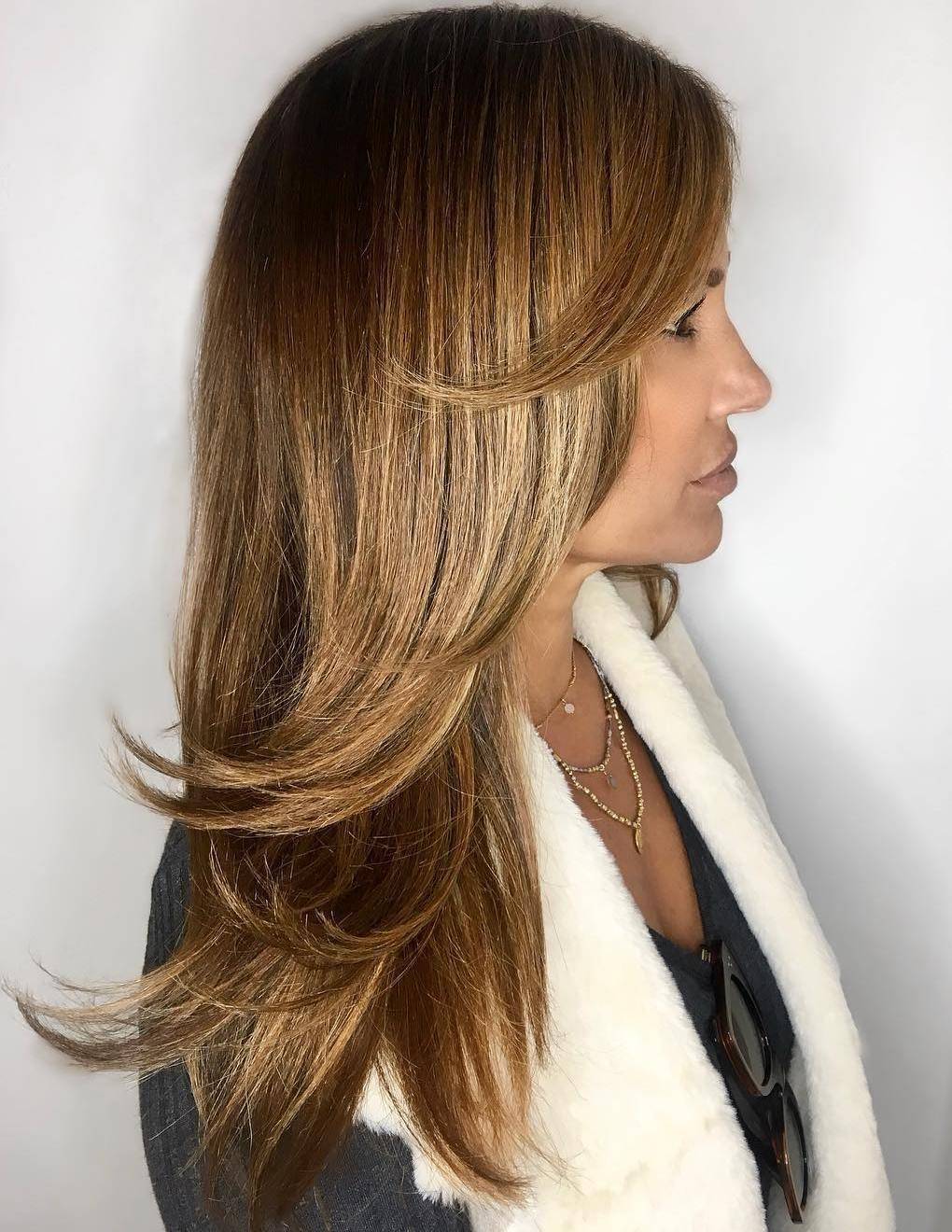 Woman with brown swoopy layered hair