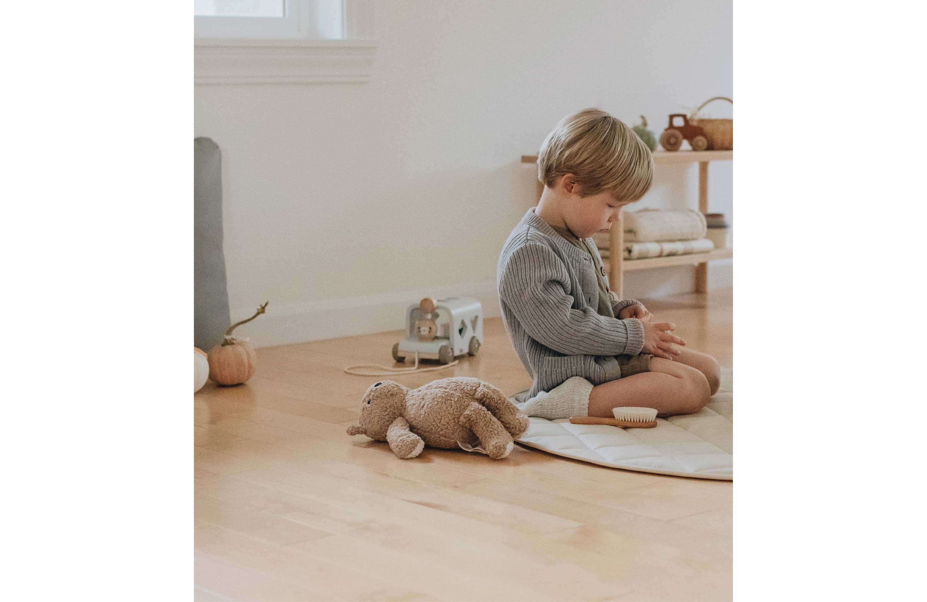 Boy playing with toys while sitting on Quilted Mini Circle