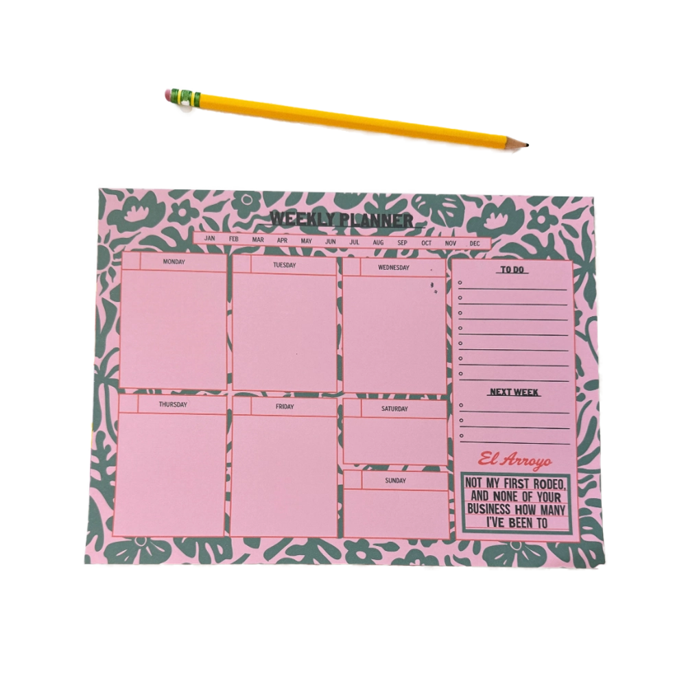 Weekly planner with pink sections and a yellow pencil.