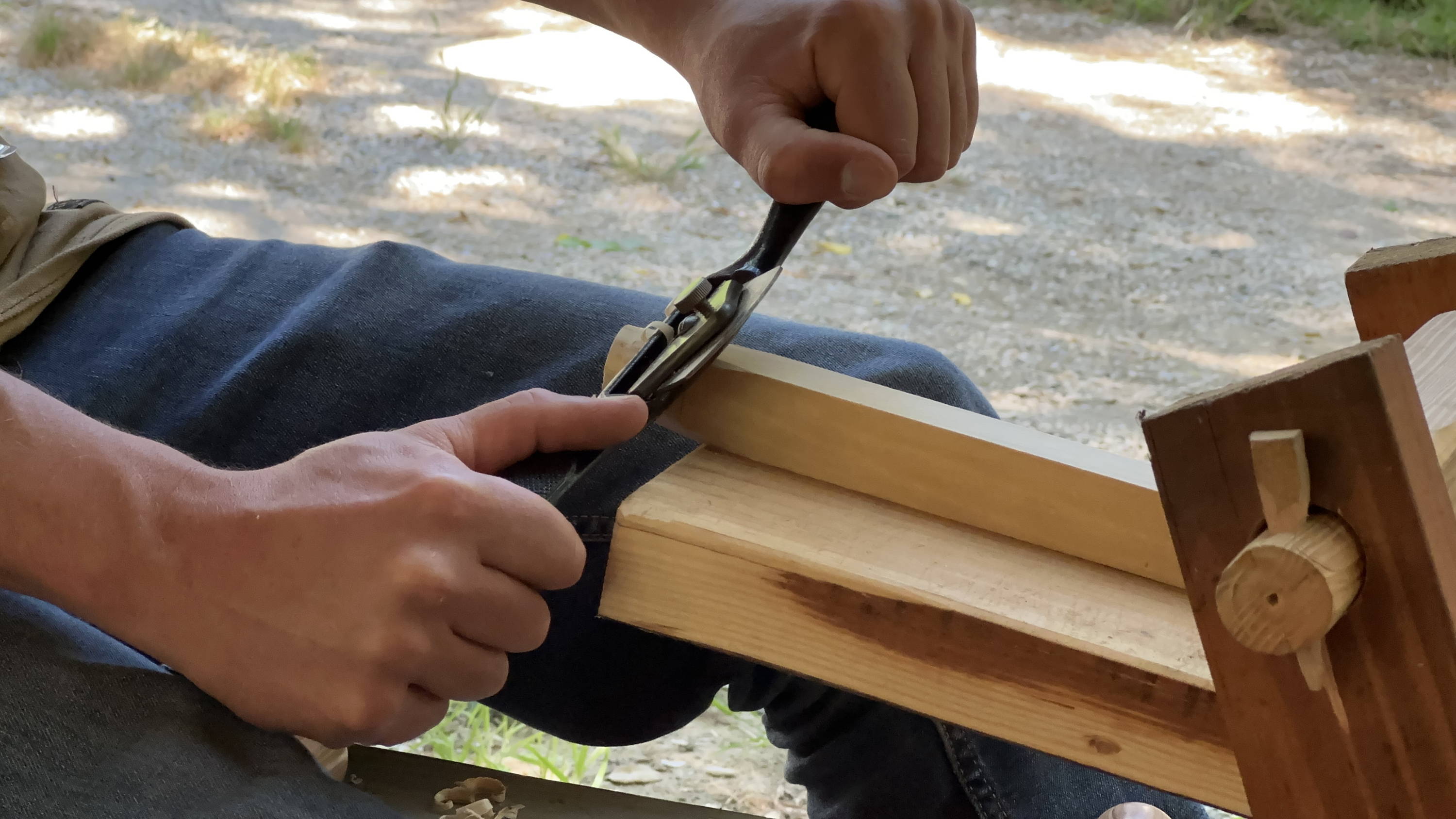 using a spokeshave on a shavehorse