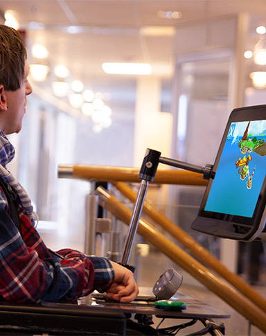 Victor Kaiser playing accessible games with his Tobii Dynavox eye gaze device