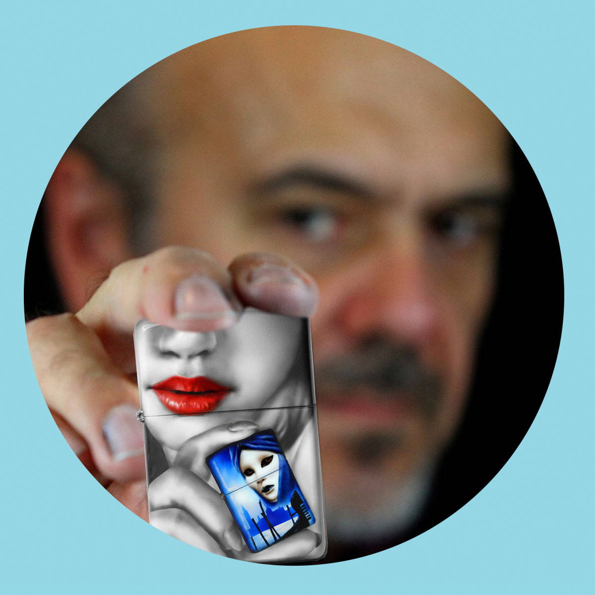 Claudio Mazzi holding one of his Zippo designs.