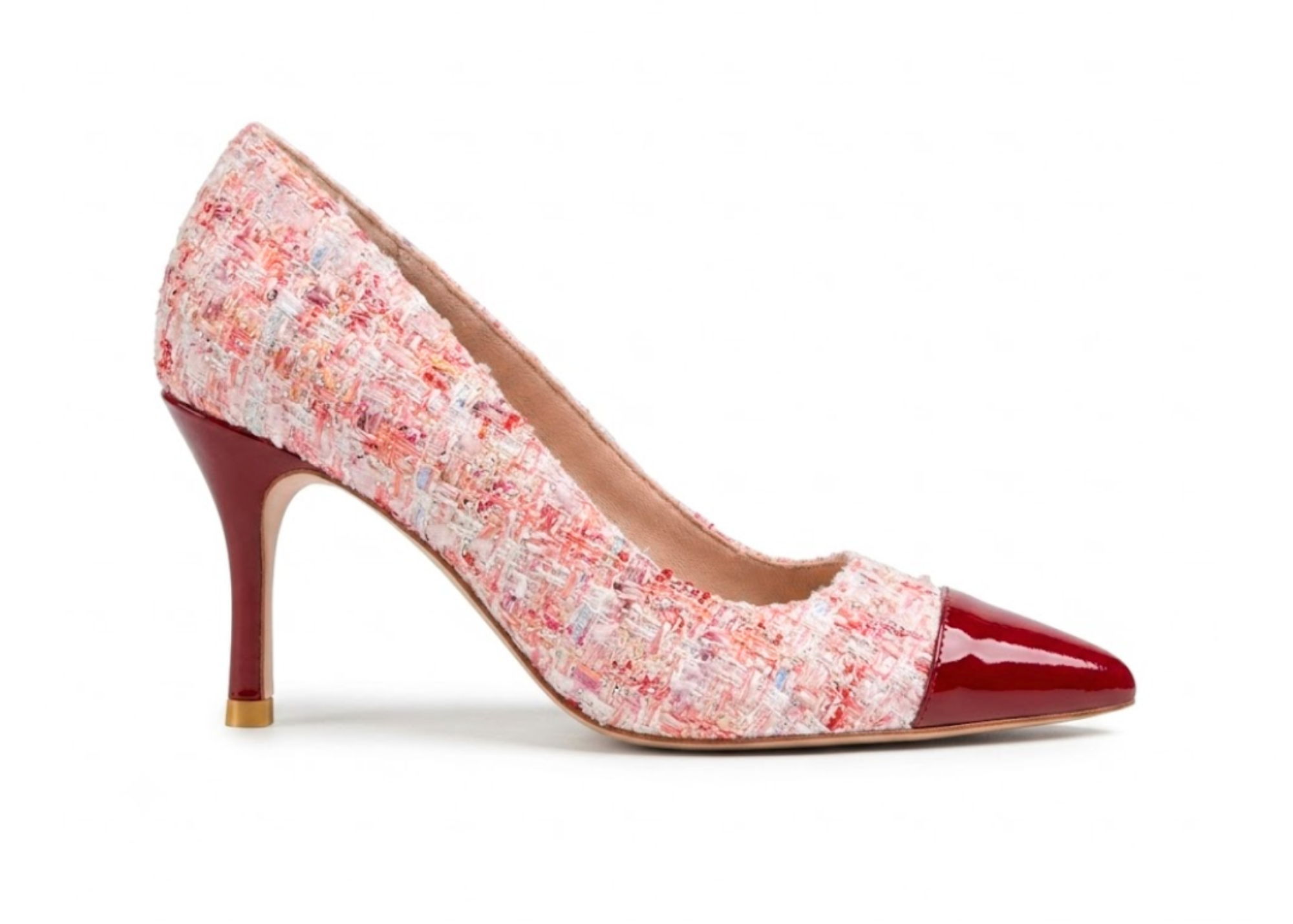 Pink floral high-heeled shoe with a red pointed toe.