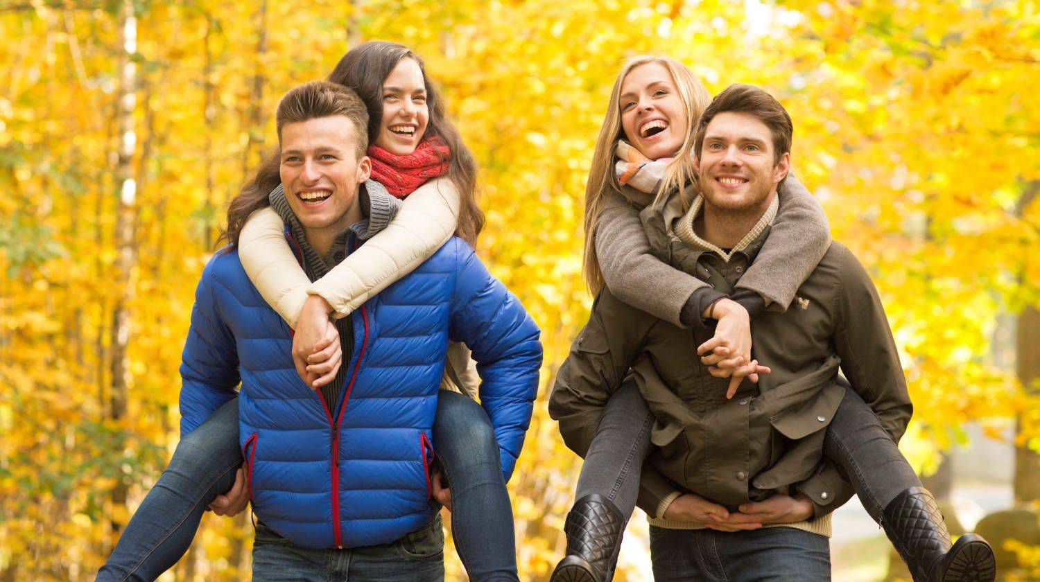 Smiling friends having fun in autumn park | Baby It's Gold Outside! Outdoor Fall Activities To Do To Stay Active This Season | Fall activities | Featured