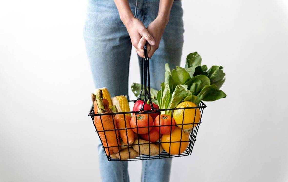 Person Holding Shopping Basket