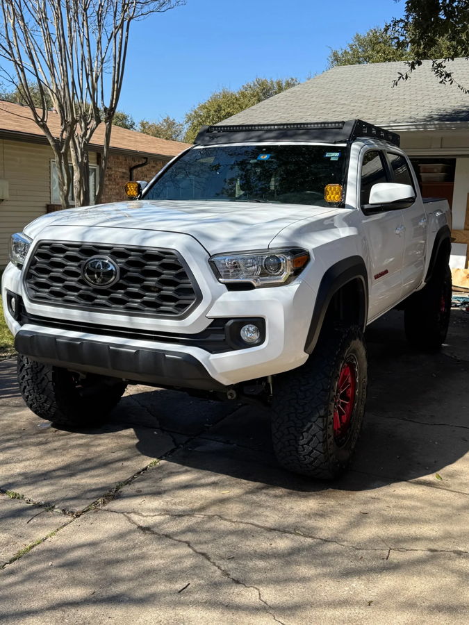 Front three-quarter white Tacoma TRD Off-Road Prinsu rack LED bar amber ditch lights sunny driveway Joel's 2-Chime 3-Liter gallery photo 2