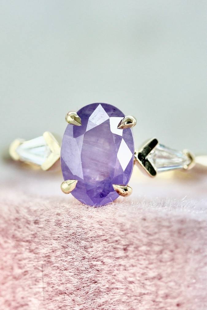Purple Opalescent Oval Cut Sapphire Ring With Kite Diamond Sides