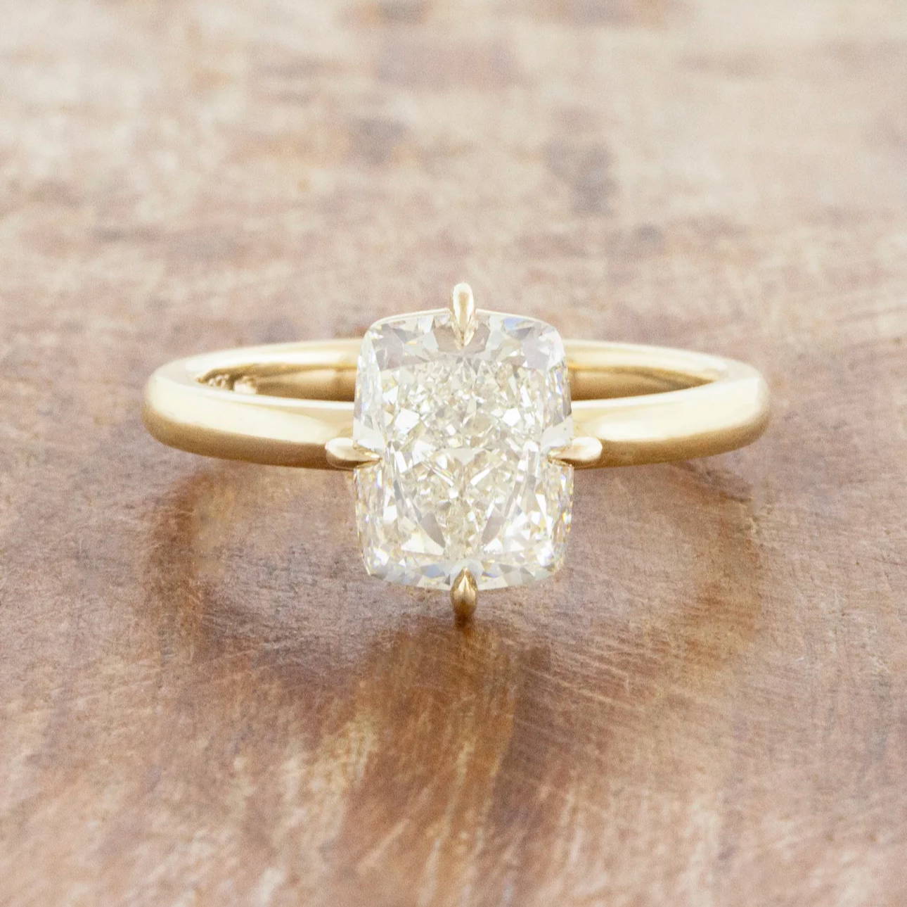 caption:Shown with 3ct cushion cut in 14k yellow gold 