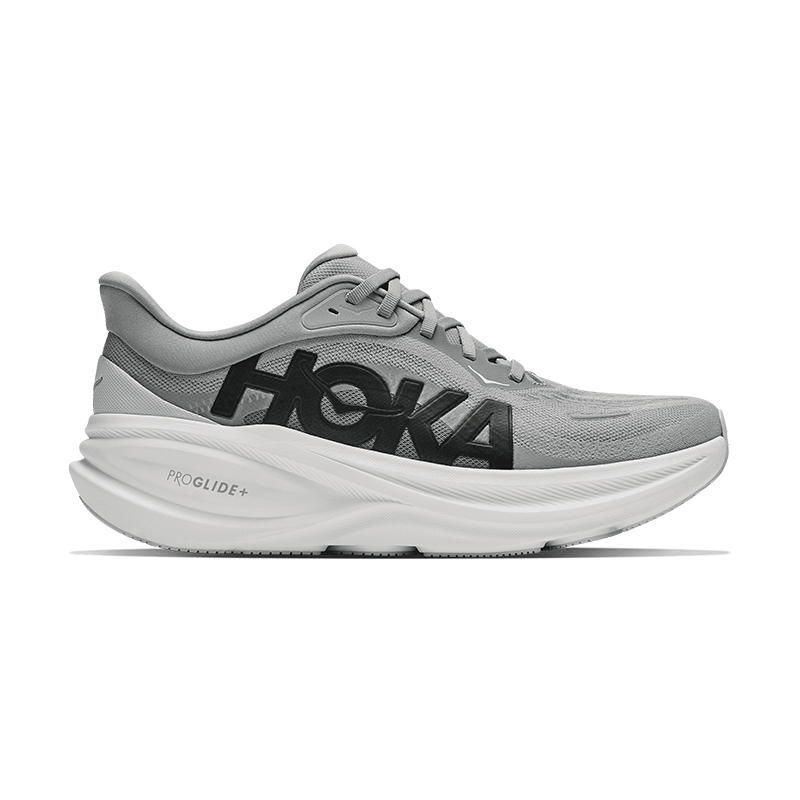 Gray HOKA running shoes with a thick white sole.