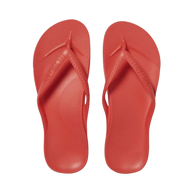 Red flip-flops viewed from above.