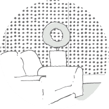A minimalist living room with a sofa and a decorative lamp.
