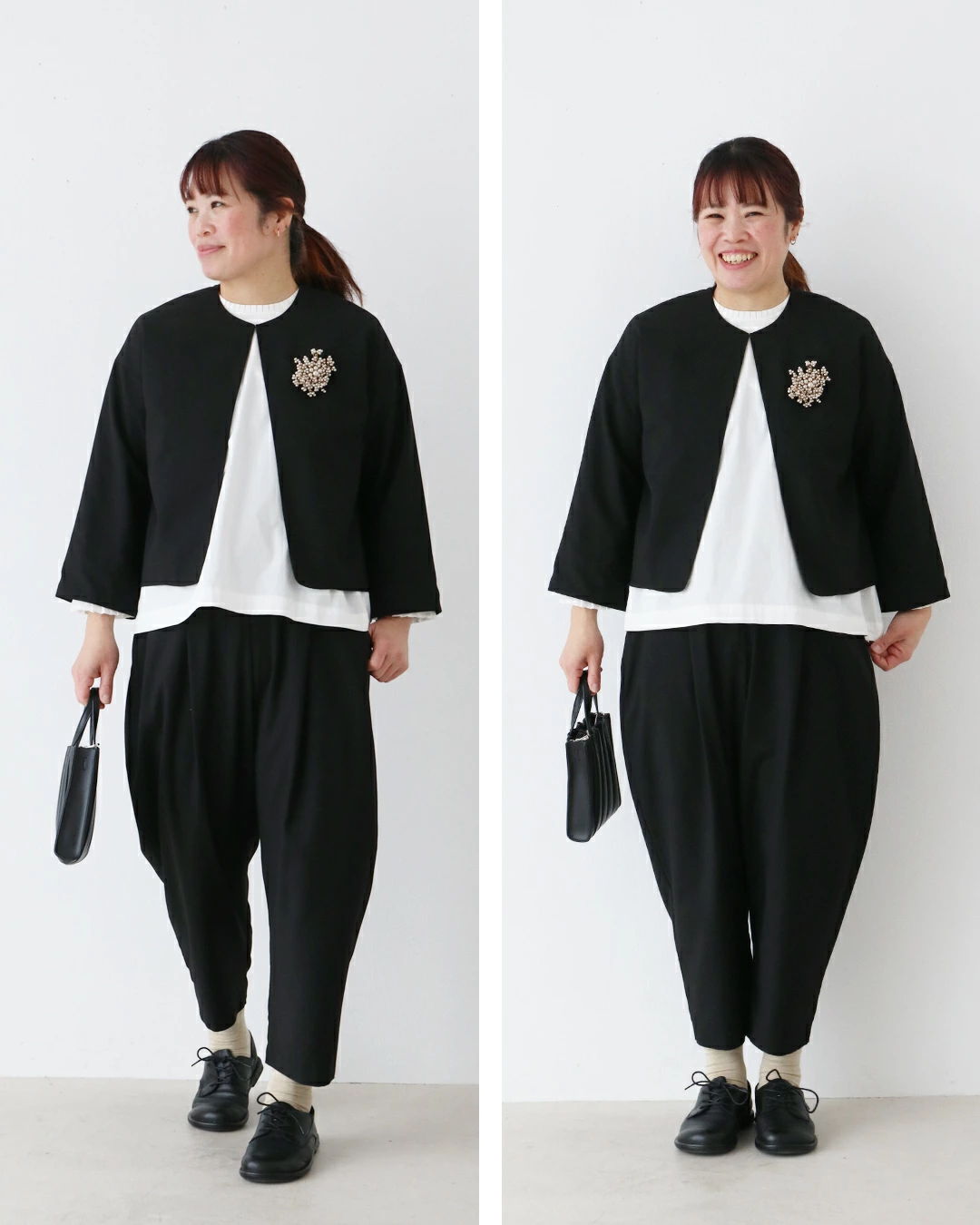 A woman in stylish black outfit and accessories, posing against a white background.