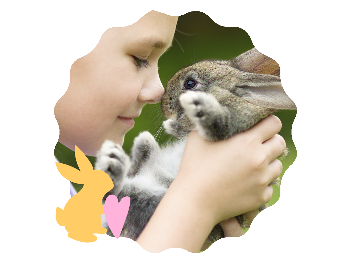A young girl nose to nose with a brown bunny- Babo Botanicals
