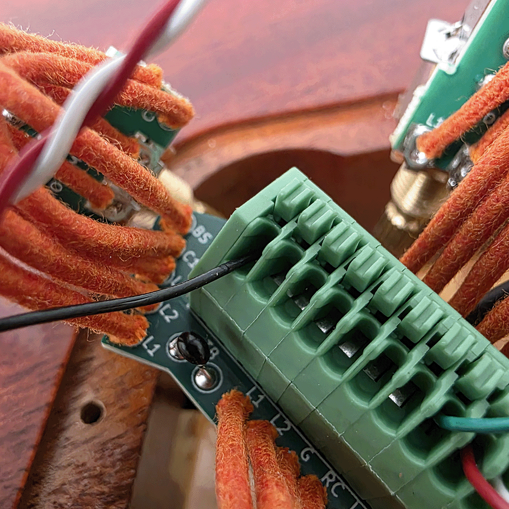 Close-up of circuit board connections with colorful wires.