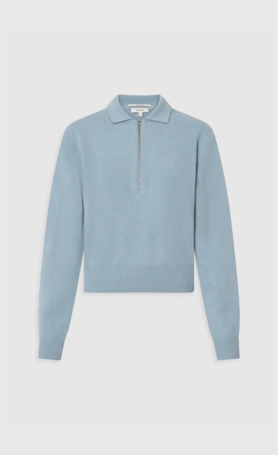 Light blue zip-up sweater with long sleeves and a collar.
