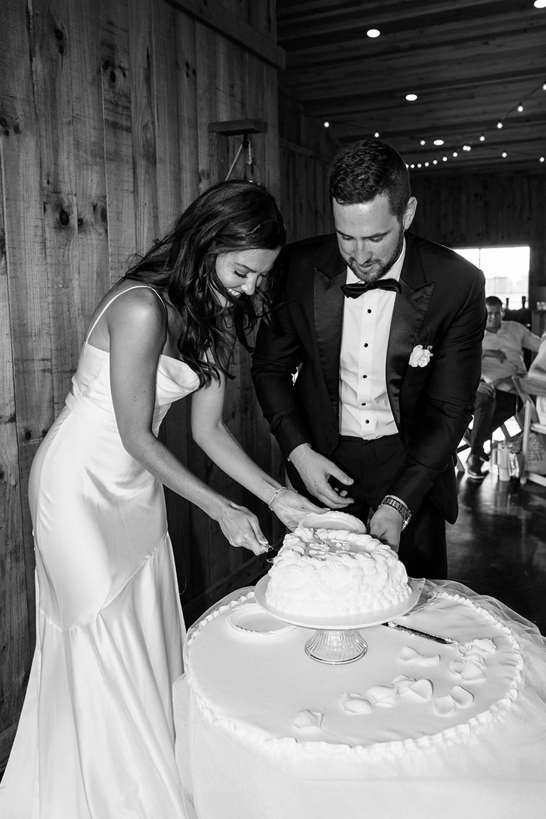 Bride and groom, cutting their wedding cake