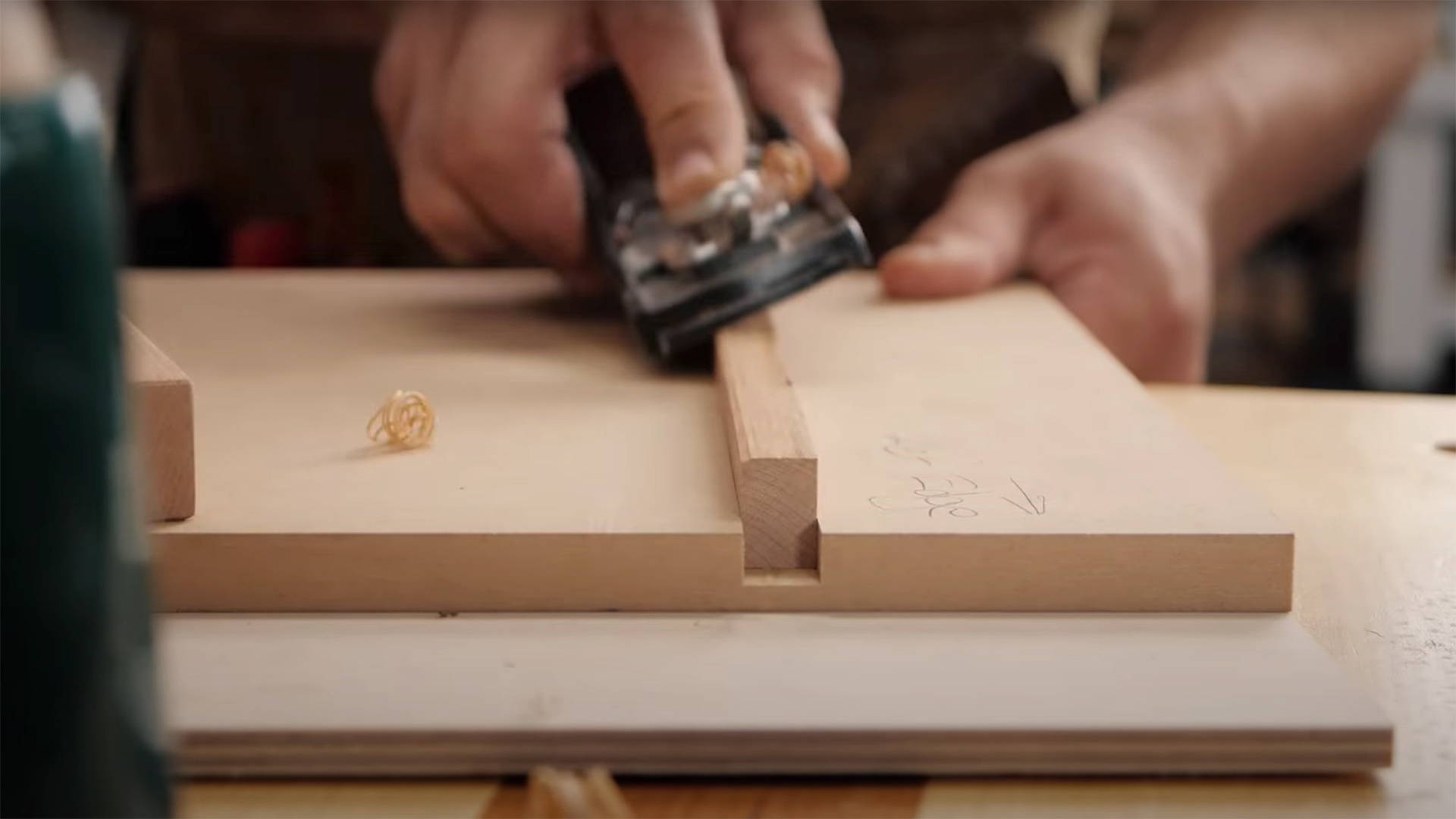 Chamfering edges of shooting board key