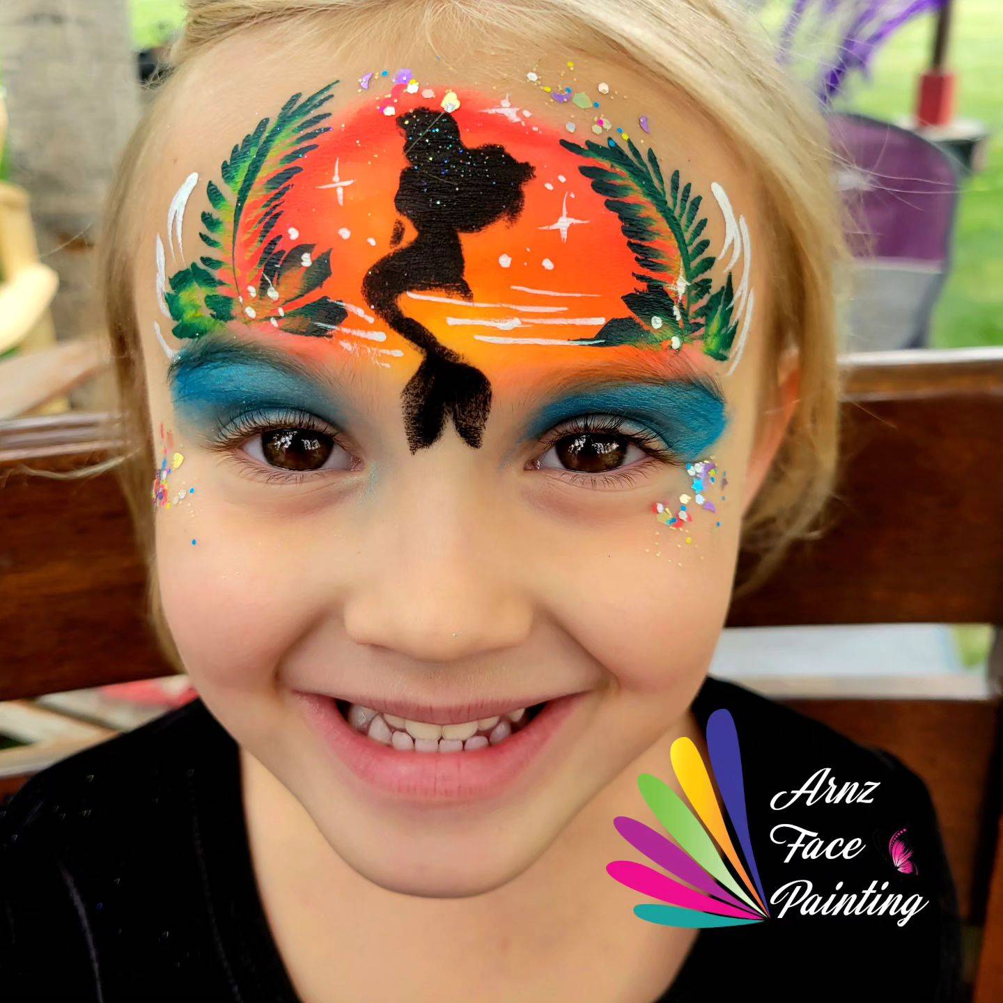 mermaid face paint forehead and mask design with stencil orange background