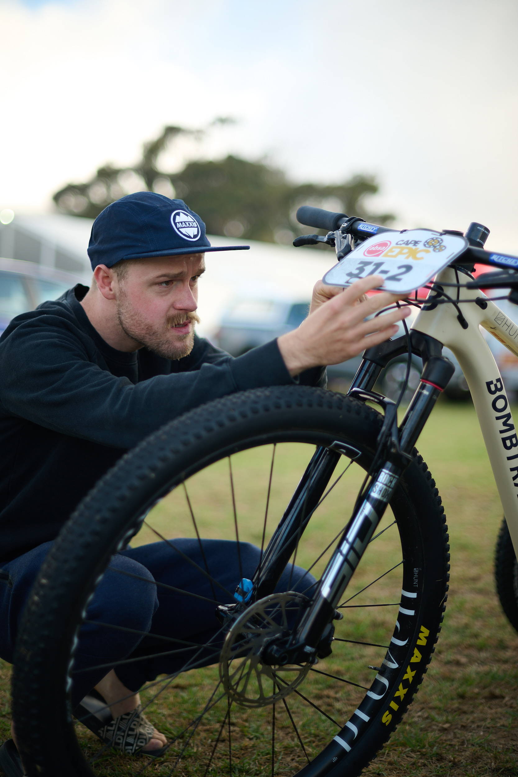 Gossee attaching his race number to his bike