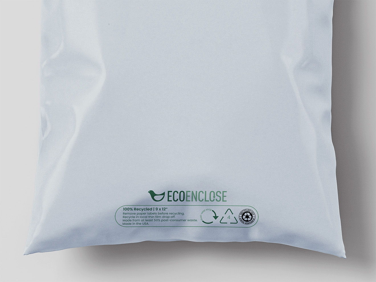 White packaging bag with recycling symbols and brand logo at the bottom.
