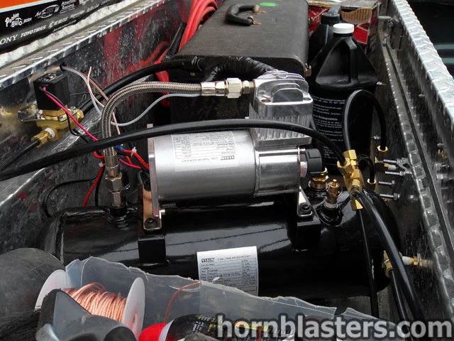 Air tank and compressor assembly installed inside the bed toolbox