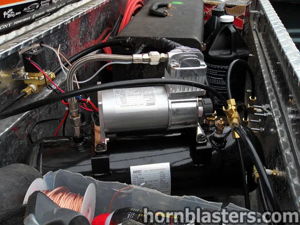 Air tank and compressor assembly installed inside the bed toolbox