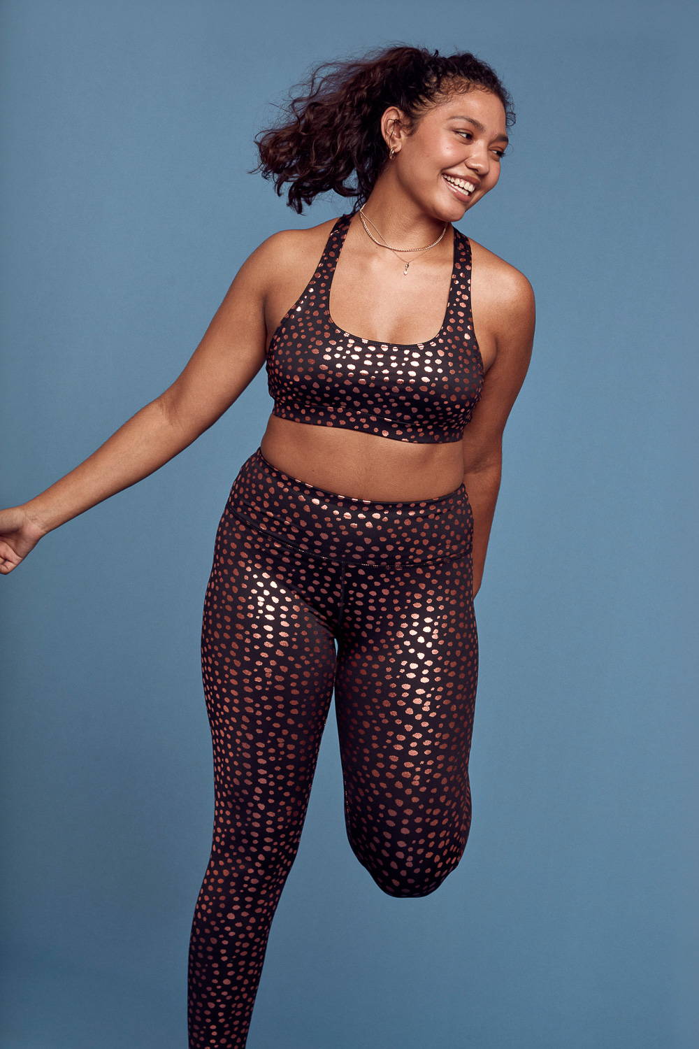Trixxi Wholesale Active link , girl in copper printed leopard all over sports bra and high waisted legging.