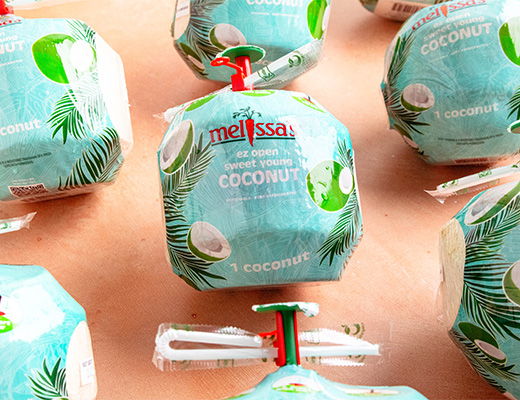 Coconut packages with tropical designs on a light background.