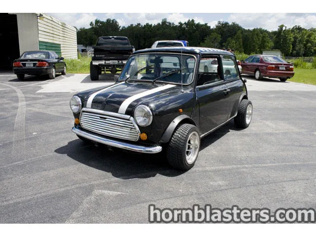 Side profile Chad's 1970 MINI Cooper vintage two-door hatchback wheels tires body lines Conductor's Special 844K setup gallery photo 2