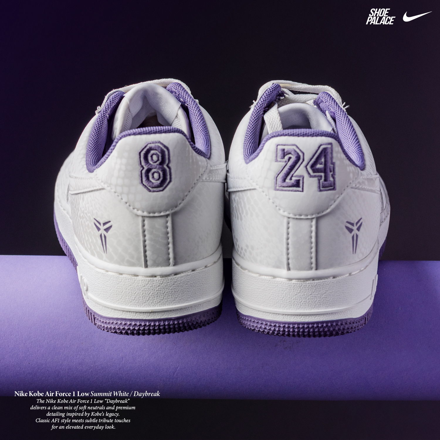 Back view of purple and white sneakers with numbers 8 and 24.