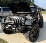 Front three-quarter black 2012 Jeep JK Wrangler Sport hood open winch bumper LED lights Ricky's Wrango Horn Kit Nightmare Edition Dixie musical horn featured customer install gallery photo 1