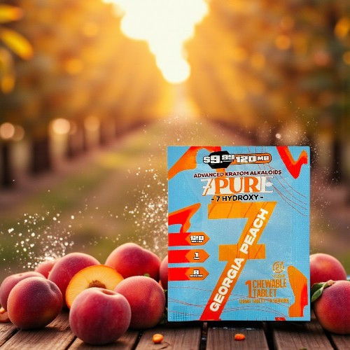 Box of peach-flavored product with fresh peaches in an orchard setting.