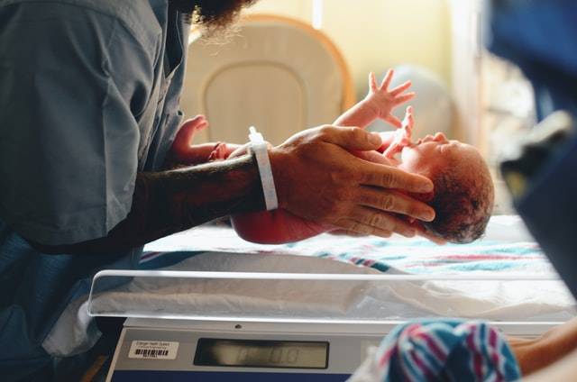 Person Holding A Baby