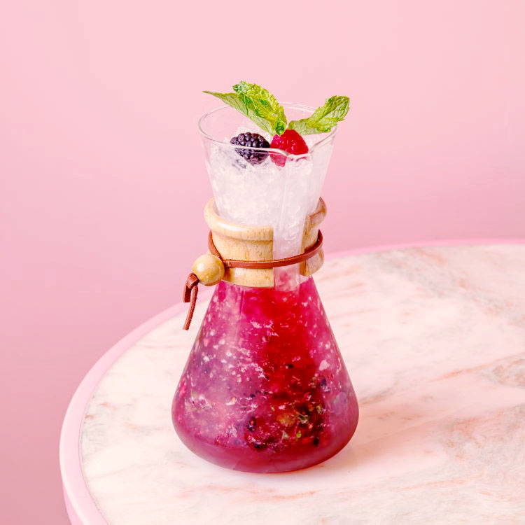 Chemex Mixed Berry Mojito Mocktail in pink background