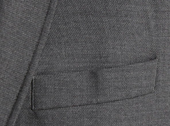 Close-up of a gray fabric with a pocket detail.