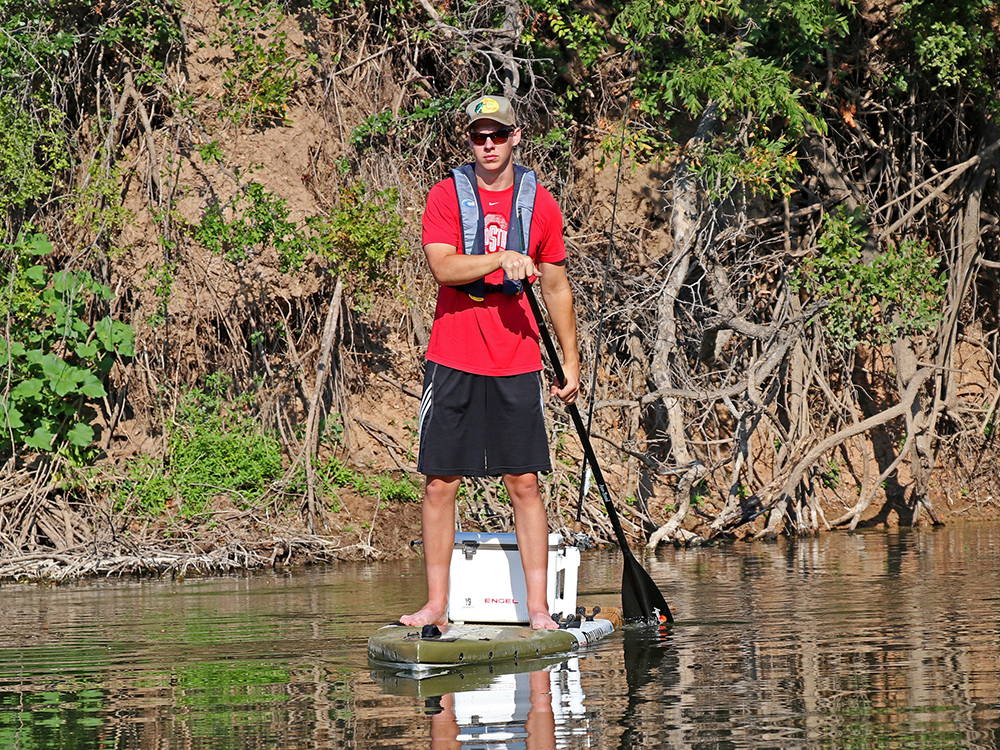 man paddling the pau hana endurance board