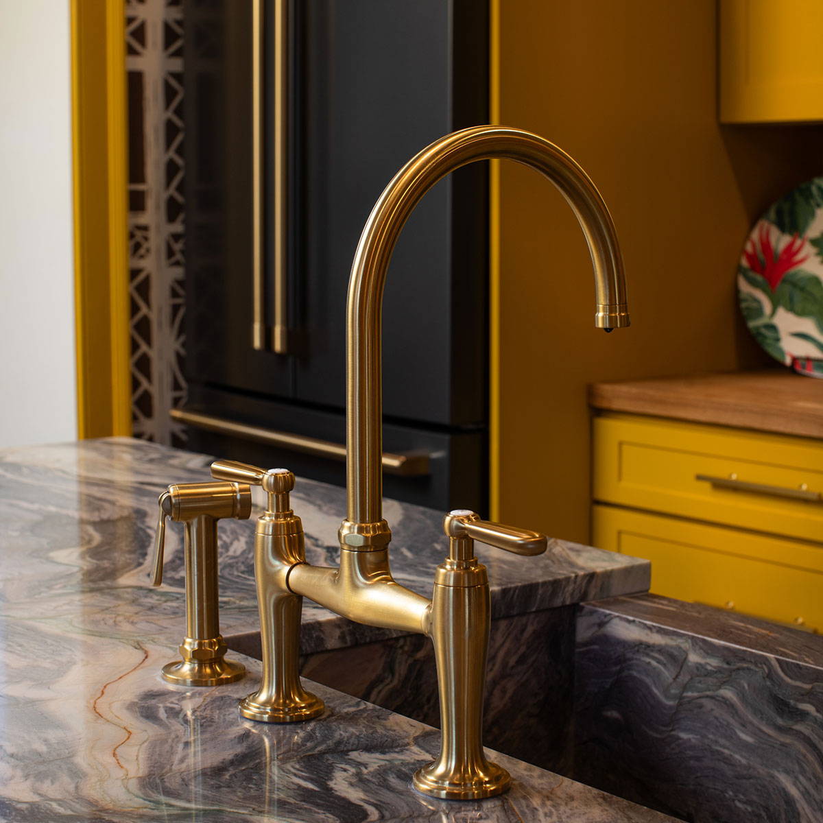 Kohler faucet in Vibrant Brushed Moderne Brass with matching Cafe Brushed Brass hardware in background