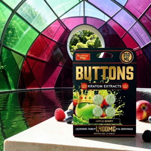 Box of kratom extract buttons in colorful setting.