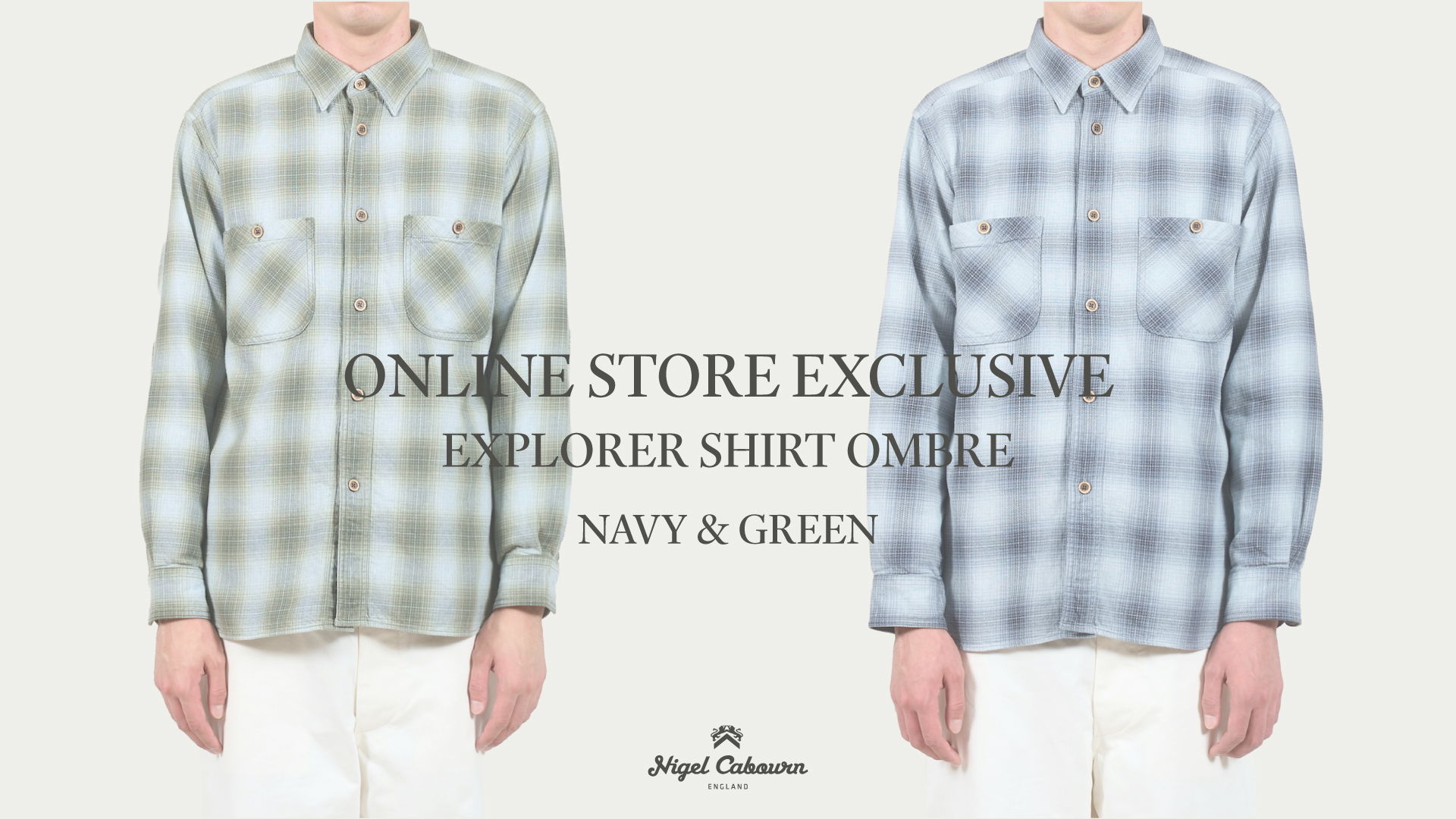 Two men wearing plaid shirts in navy and green. Online store exclusive.