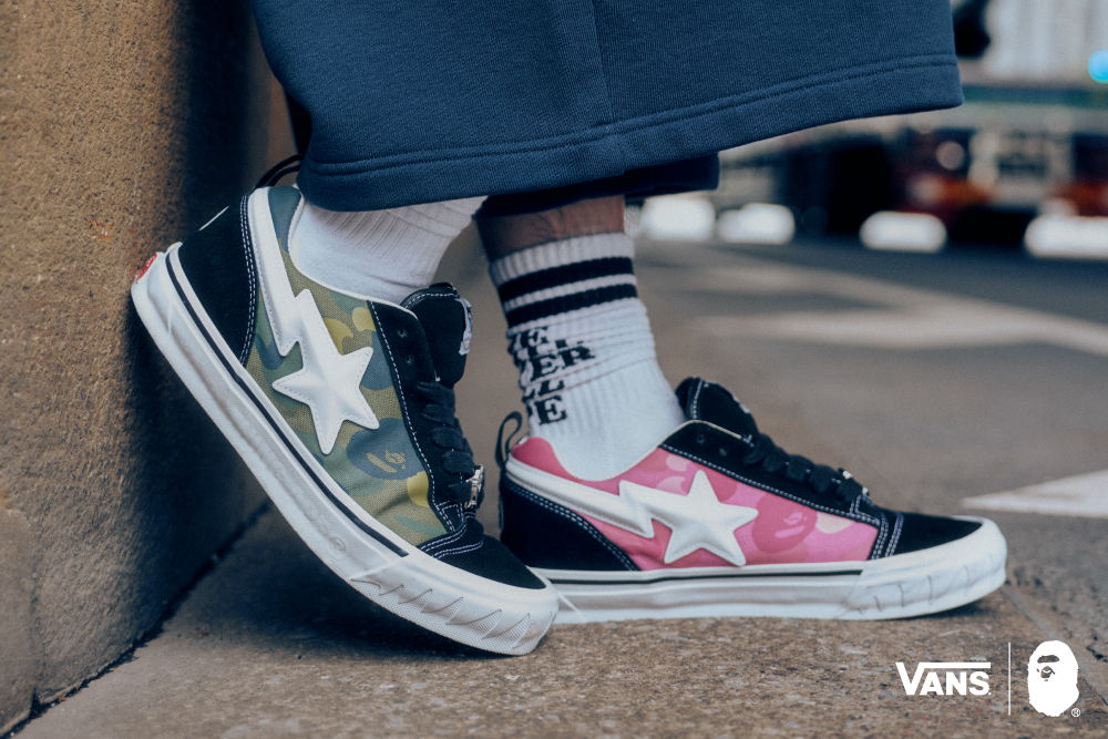Colorful Vans shoes with different designs worn with striped socks.