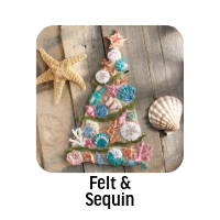Felt & Sequin. Image: Bucilla Coastal Christmas Wall Hanging Felt & Sequin Kit.