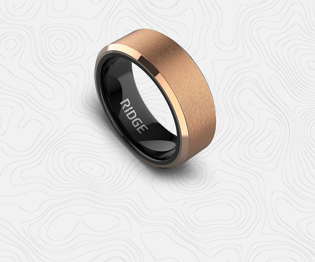 A sleek, modern ring with a copper and black design.