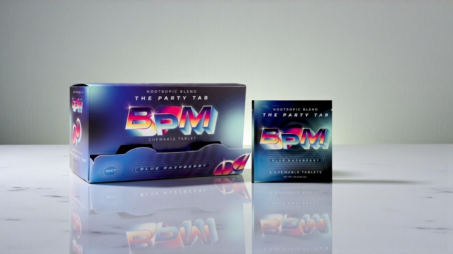 Box and package of a product with vibrant design on a countertop.