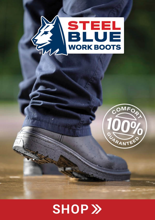 Person wearing Steel Blue work boots, standing on wet ground.