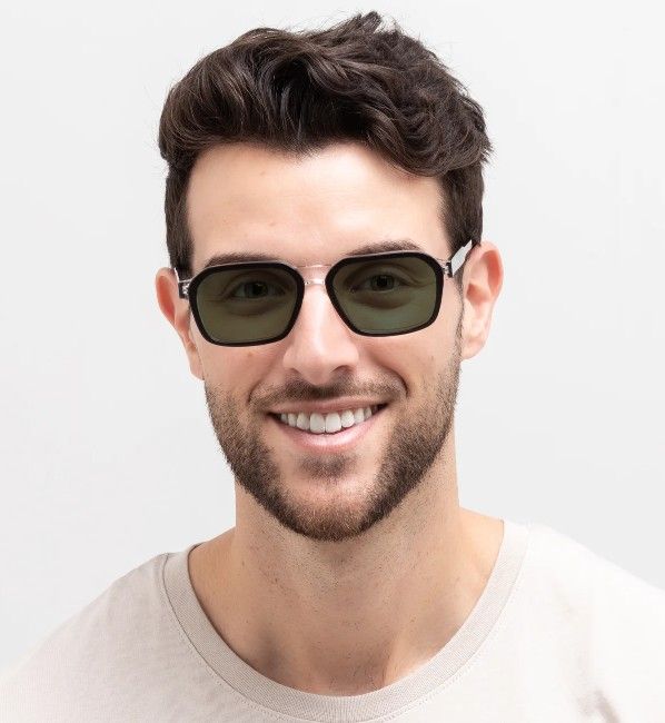 Male wearing green transition lens glasses