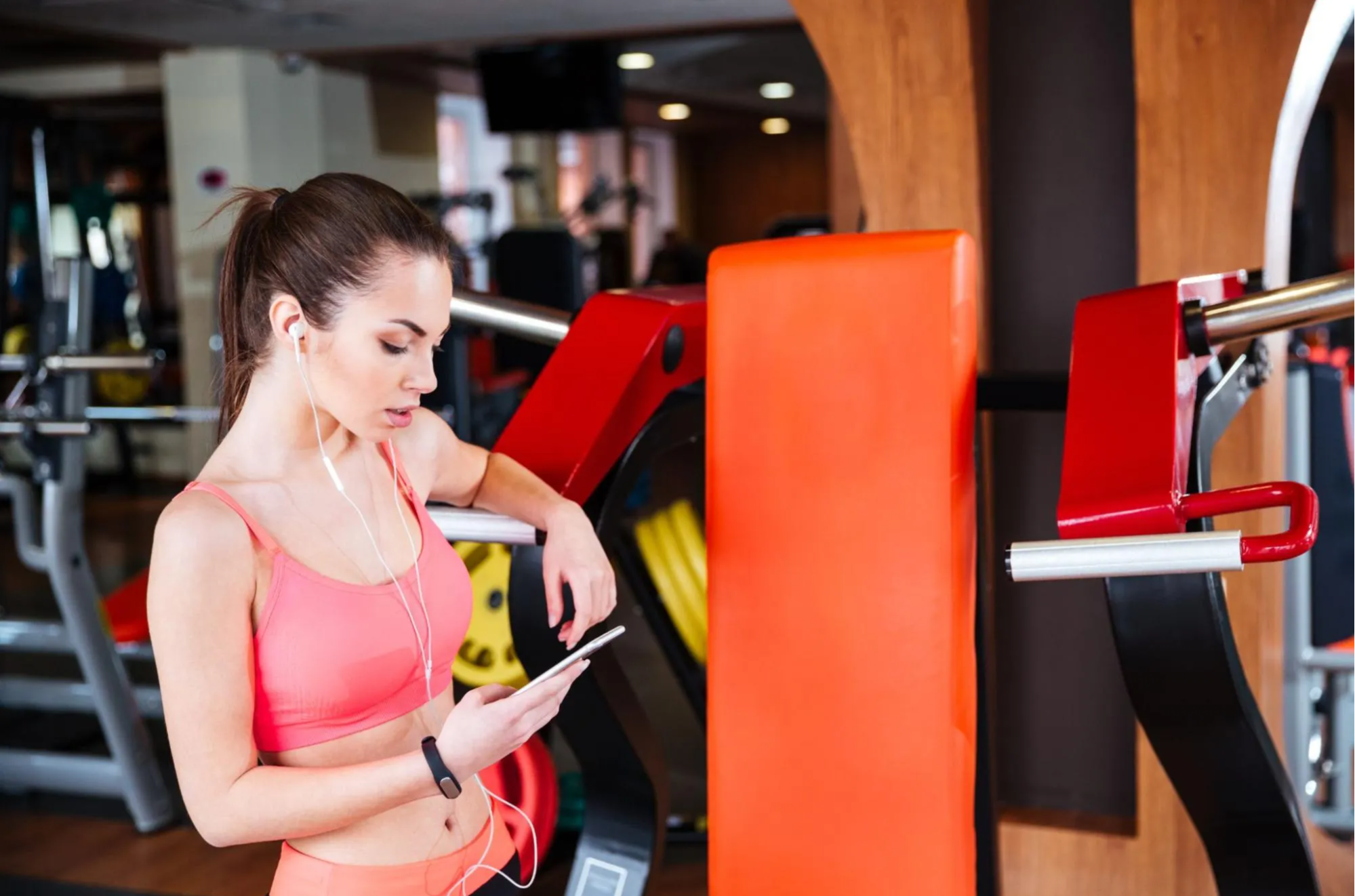 woman on phone at gym