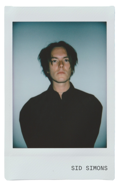 Portrait of a person with dark hair, wearing a black shirt.