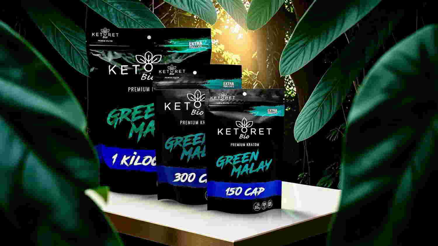 Bags of green ma products on a table surrounded by leaves.